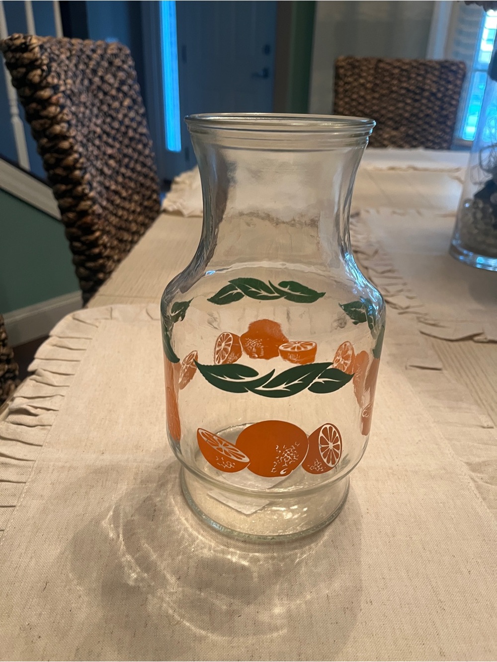 Vintage-Inspired Orange Glass Pitcher with Green Leaf Motif